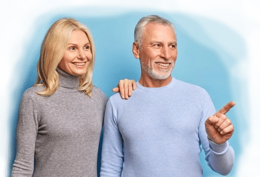 mature homeowner couple pointing to benefits of selling house fast for cash