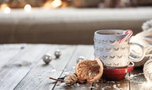 How to Deal with Problem Tenants During the Holidays cup of cocoa and candy cane